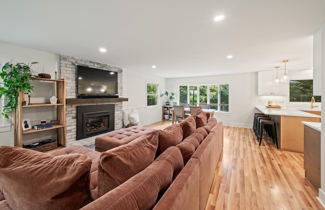 12 Warner Rd, East Haddam, CT 06423 - living room featuring light wood-style flooring, a brick fireplace, and recessed lighting