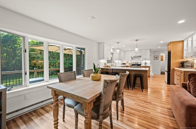 12 Warner Rd, East Haddam, CT 06423 - dining area featuring plenty of natural light, light wood-type flooring, recessed lighting, and a baseboard heating unit