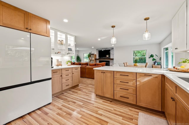 12 Warner Rd, East Haddam, CT 06423 - kitchen featuring freestanding refrigerator, light wood-style floors, plenty of natural light, recessed lighting, and light countertops