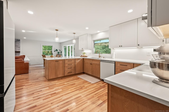 12 Warner Rd, East Haddam, CT 06423 - kitchen with dishwashing machine, a peninsula, light wood finished floors, open floor plan, and recessed lighting