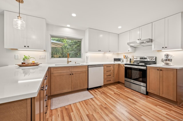 12 Warner Rd, East Haddam, CT 06423 - kitchen with stainless steel electric range oven, under cabinet range hood, dishwasher, light wood-style flooring, and light countertops