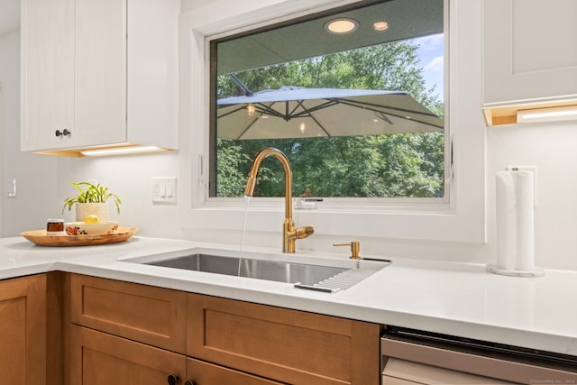 12 Warner Rd, East Haddam, CT 06423 - kitchen with dishwashing machine, light countertops, and brown cabinetry