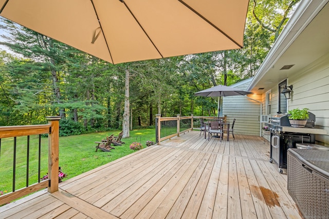 12 Warner Rd, East Haddam, CT 06423 - wooden terrace with outdoor dining area, a lawn, view of scattered trees, and area for grilling