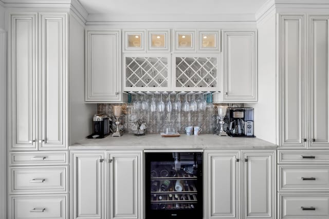 423 Whitfield St, Guilford, CT 06437 - indoor dry bar featuring wine cooler and tasteful backsplash