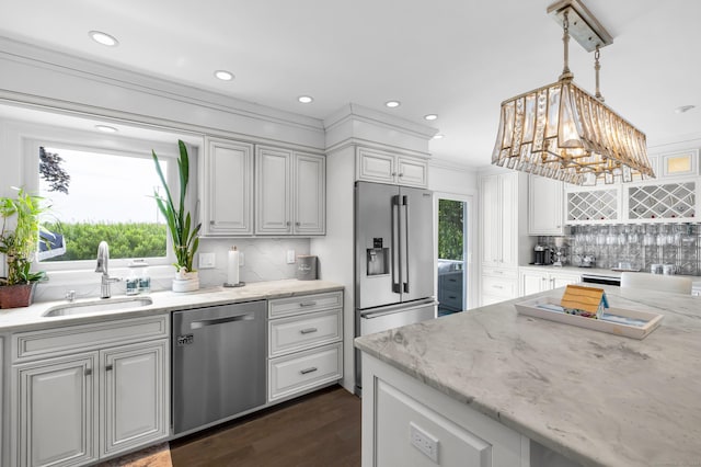 423 Whitfield St, Guilford, CT 06437 - kitchen featuring stainless steel appliances, backsplash, light stone counters, dark wood-style flooring, and hanging light fixtures