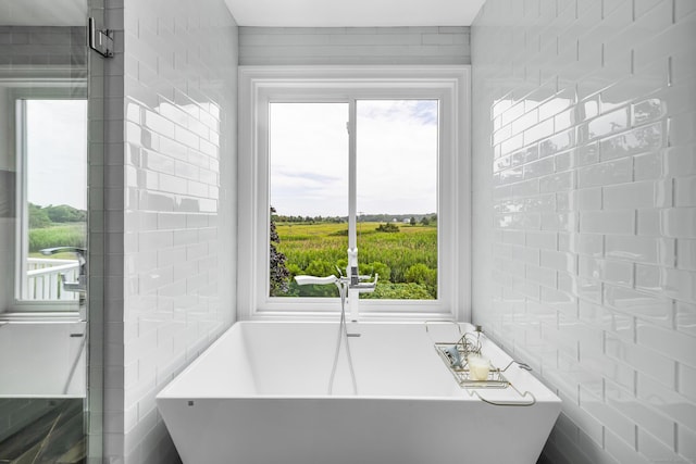 423 Whitfield St, Guilford, CT 06437 - bathroom with plenty of natural light and a soaking tub