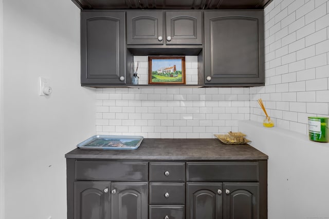 423 Whitfield St, Guilford, CT 06437 - kitchen featuring dark countertops, tasteful backsplash, and gray cabinets