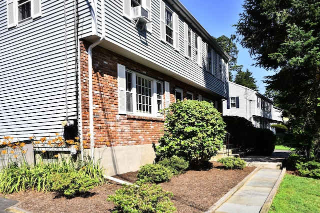 84 Parade Hill Rd Unit 84, New Canaan, CT 06840 - view of side of home featuring brick siding and cooling unit