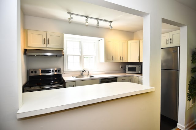 84 Parade Hill Rd Unit 84, New Canaan, CT 06840 - kitchen featuring stainless steel appliances, exhaust hood, light countertops, a peninsula, and white cabinets