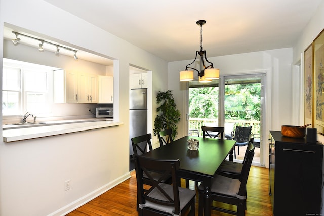 84 Parade Hill Rd Unit 84, New Canaan, CT 06840 - dining space with wood finished floors and baseboards