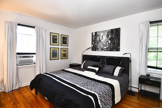 84 Parade Hill Rd Unit 84, New Canaan, CT 06840 - bedroom with wood finished floors, multiple windows, a baseboard radiator, and cooling unit