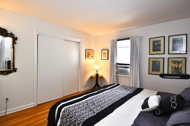 84 Parade Hill Rd Unit 84, New Canaan, CT 06840 - bedroom with wood finished floors, cooling unit, and a closet