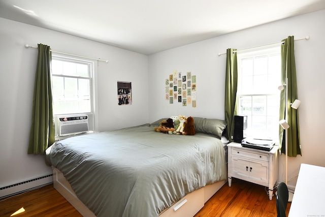 84 Parade Hill Rd Unit 84, New Canaan, CT 06840 - bedroom featuring baseboard heating, wood finished floors, and cooling unit