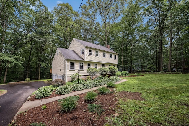 310 Opening Hill Rd, Madison, CT 06443 - view of front facade with an attached garage, driveway, a chimney, and a front lawn