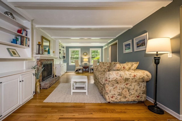 310 Opening Hill Rd, Madison, CT 06443 - living room featuring wood finished floors, a brick fireplace, beamed ceiling, and crown molding