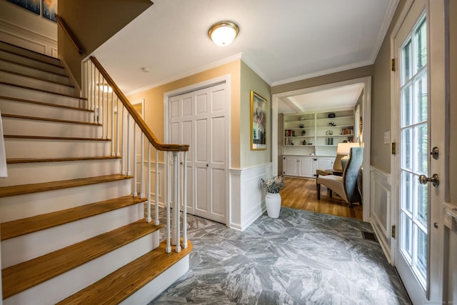 310 Opening Hill Rd, Madison, CT 06443 - entrance foyer featuring stairway, wainscoting, ornamental molding, and a decorative wall