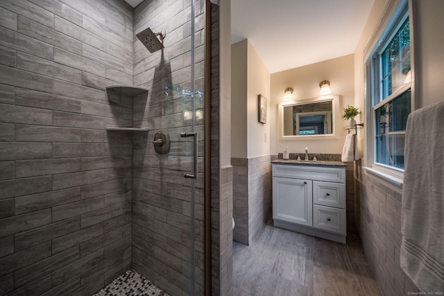 310 Opening Hill Rd, Madison, CT 06443 - full bath featuring tile walls, a tile shower, vanity, and a wainscoted wall