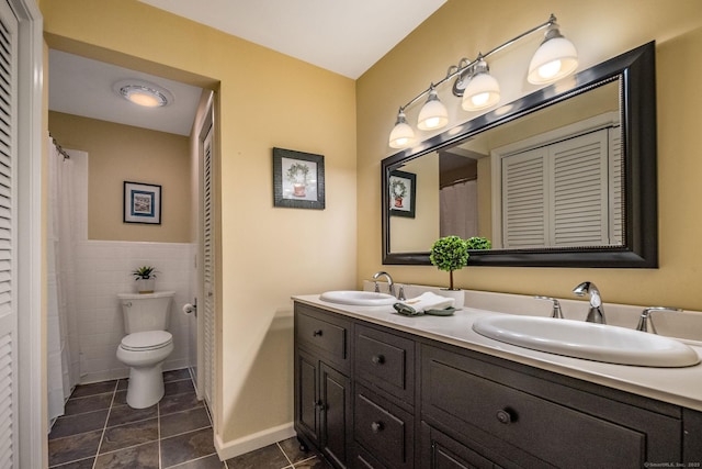 310 Opening Hill Rd, Madison, CT 06443 - full bathroom with double vanity, a closet, tile patterned floors, and tile walls