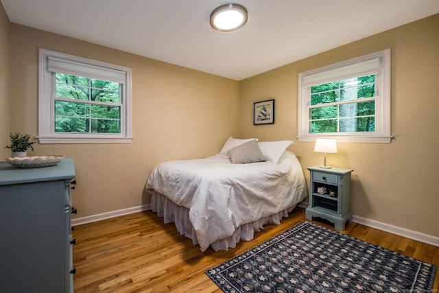 310 Opening Hill Rd, Madison, CT 06443 - bedroom featuring multiple windows and light wood-style floors