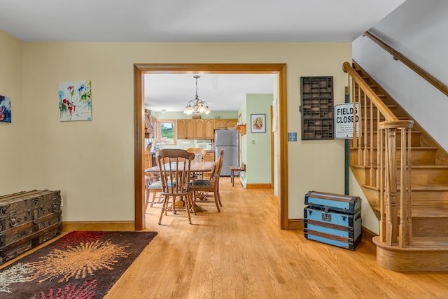 4 Overlook Dr, North Branford, CT 06471 - dining space featuring stairs, light wood finished floors, and a chandelier