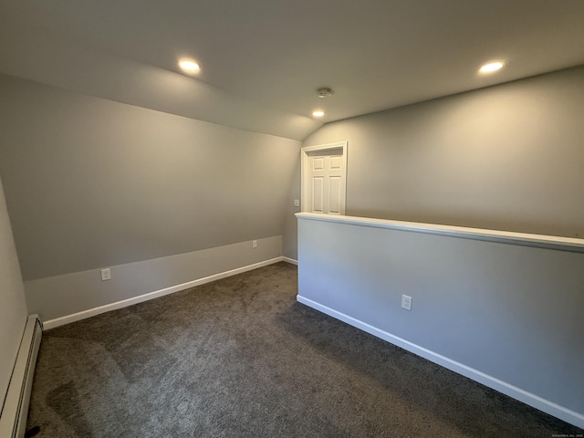 20 Greystone St, Windham, CT 06226 - empty room featuring a baseboard radiator, vaulted ceiling, dark carpet, and recessed lighting
