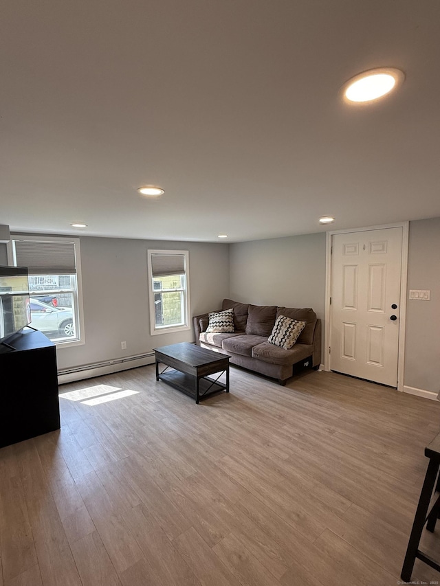 20 Greystone St, Windham, CT 06226 - living area with baseboard heating, wood finished floors, and recessed lighting