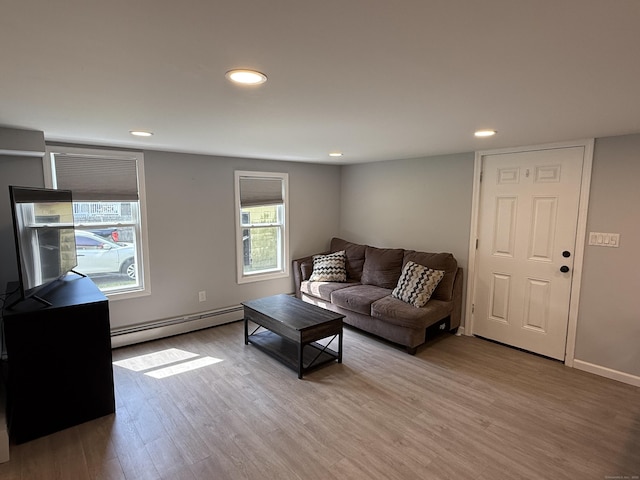 20 Greystone St, Windham, CT 06226 - living room with a baseboard heating unit, light wood finished floors, and recessed lighting