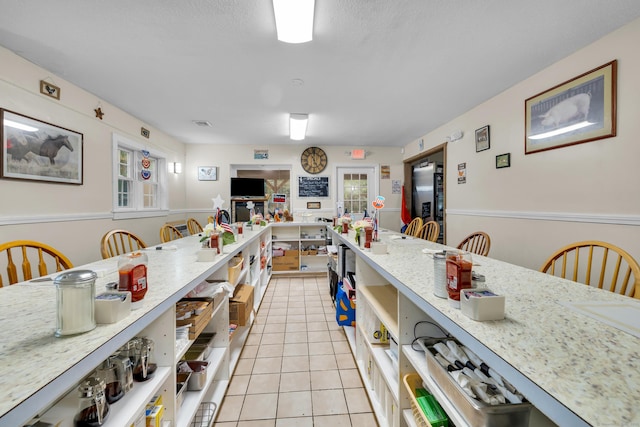 678 Colonel Ledyard Hwy, Ledyard, CT 06339 - kitchen featuring open shelves, light tile patterned flooring, freestanding refrigerator, and light stone countertops