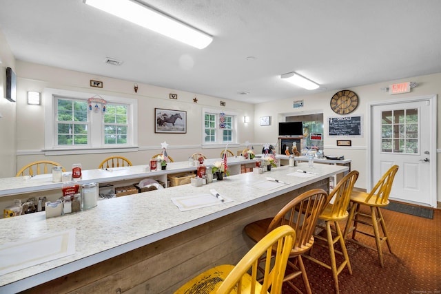 678 Colonel Ledyard Hwy, Ledyard, CT 06339 - kitchen featuring a kitchen breakfast bar and light countertops