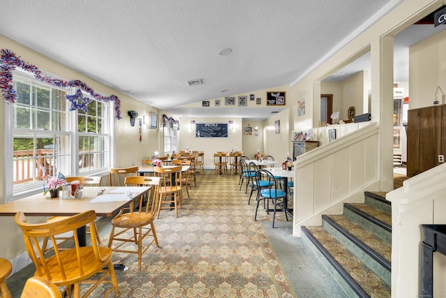 678 Colonel Ledyard Hwy, Ledyard, CT 06339 - dining space featuring a textured ceiling and lofted ceiling