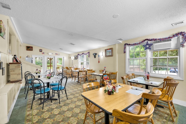 678 Colonel Ledyard Hwy, Ledyard, CT 06339 - dining space with a textured ceiling, a wall mounted air conditioner, and lofted ceiling