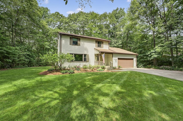 16 Eagle Ridge Dr, Ledyard, CT 06335 - view of front of house featuring driveway, an attached garage, and a front yard
