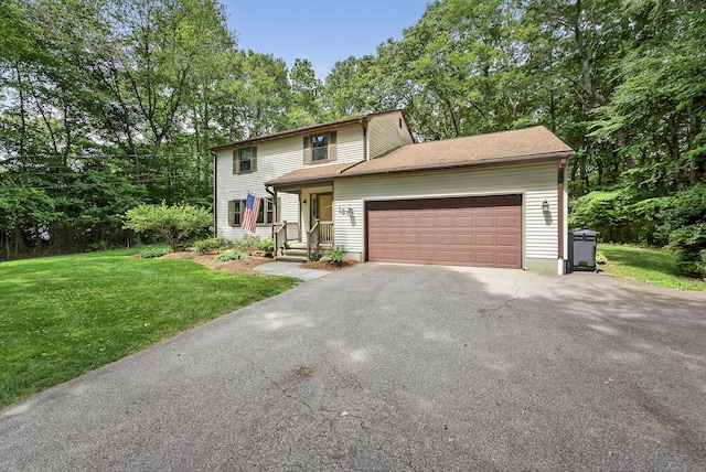 16 Eagle Ridge Dr, Ledyard, CT 06335 - view of front facade featuring asphalt driveway, an attached garage, and a front yard