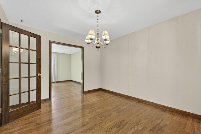 16 Eagle Ridge Dr, Ledyard, CT 06335 - empty room with a chandelier and wood finished floors