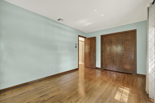 16 Eagle Ridge Dr, Ledyard, CT 06335 - unfurnished bedroom with wood finished floors and a closet