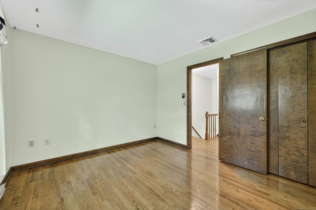 16 Eagle Ridge Dr, Ledyard, CT 06335 - unfurnished bedroom with light wood-style flooring and a closet