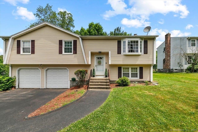 822 New Haven Ave, Milford, CT 06460 - split foyer home with driveway, a garage, and a front yard