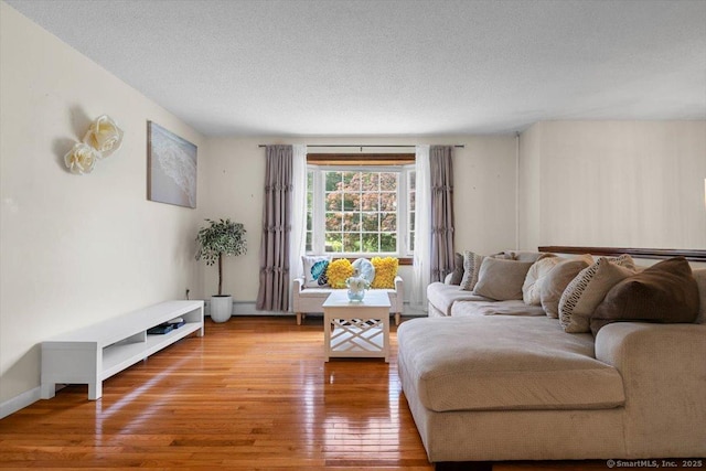 822 New Haven Ave, Milford, CT 06460 - living room featuring hardwood / wood-style floors and a textured ceiling