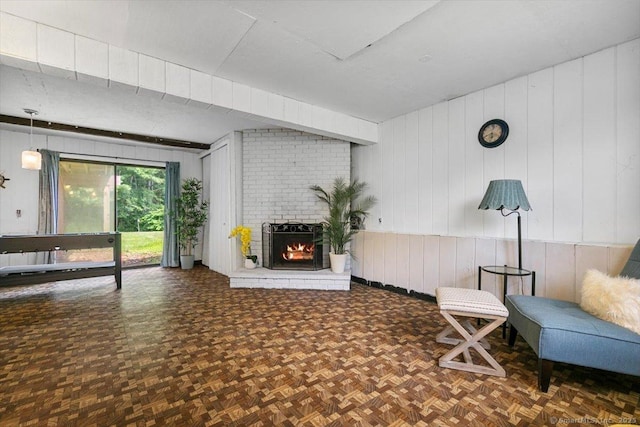 822 New Haven Ave, Milford, CT 06460 - living area featuring a fireplace and wooden walls