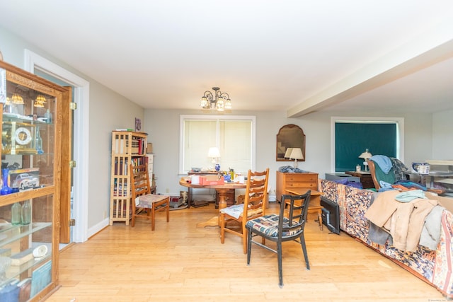 19 Main St, Plymouth, CT 06786 - living area featuring light wood finished floors and a chandelier