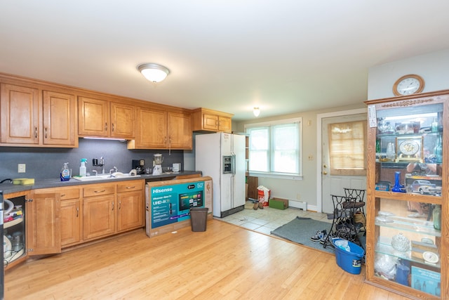 19 Main St, Plymouth, CT 06786 - kitchen featuring white fridge with ice dispenser, light wood-style floors, and brown cabinets