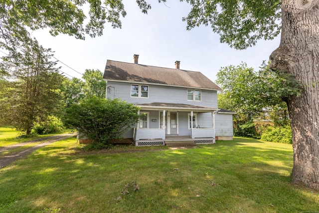 19 Main St, Plymouth, CT 06786 - back of house with a porch, a lawn, and a chimney