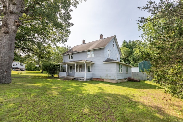 19 Main St, Plymouth, CT 06786 - rear view of house with covered porch, a chimney, a lawn, and a shingled roof