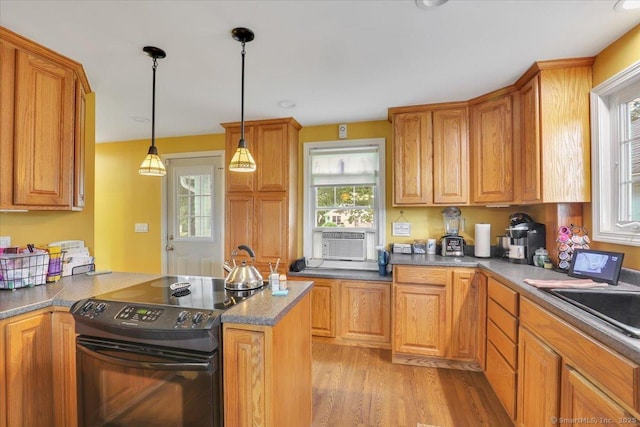 100 Adams Rd, Bloomfield, CT 06002 - kitchen featuring black / electric stove, cooling unit, light wood-style floors, a peninsula, and pendant lighting