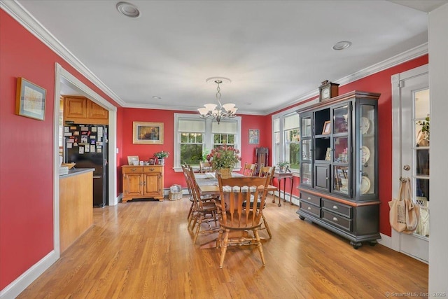 100 Adams Rd, Bloomfield, CT 06002 - dining room with a chandelier, light wood-style flooring, and ornamental molding