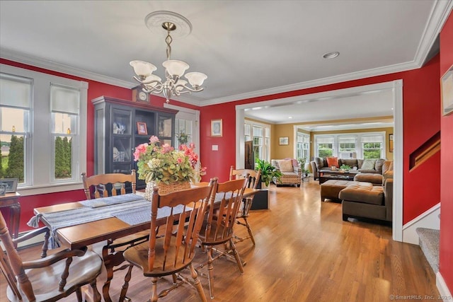 100 Adams Rd, Bloomfield, CT 06002 - dining room featuring a chandelier, wood finished floors, and crown molding