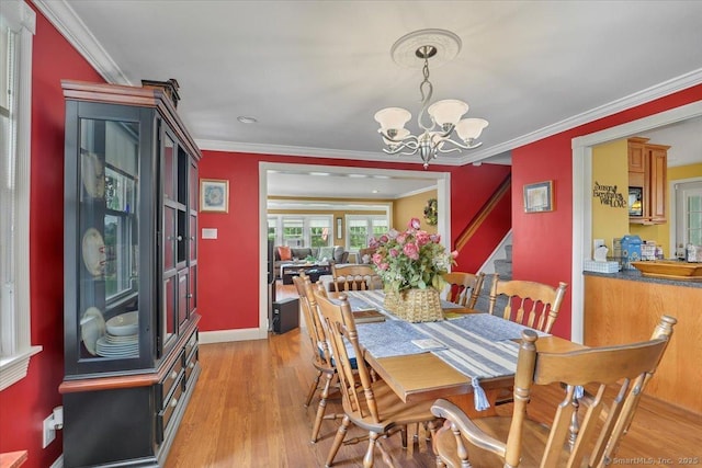 100 Adams Rd, Bloomfield, CT 06002 - dining room with a chandelier, light wood-type flooring, and ornamental molding
