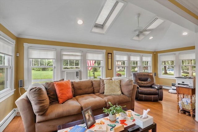 100 Adams Rd, Bloomfield, CT 06002 - living area with a baseboard heating unit, vaulted ceiling, a skylight, crown molding, and cooling unit