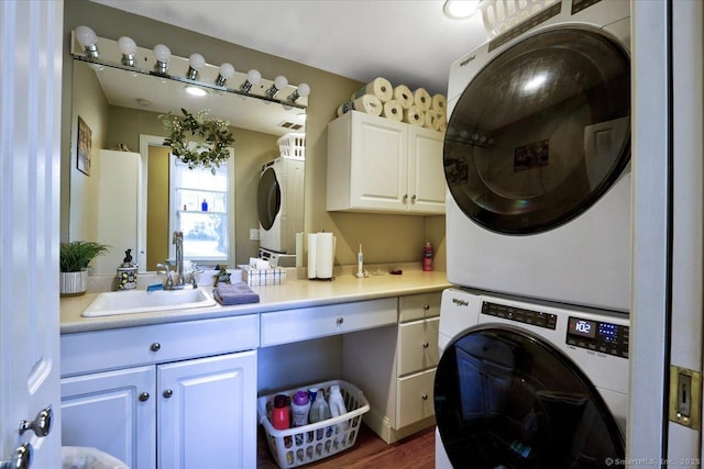 100 Adams Rd, Bloomfield, CT 06002 - laundry area with stacked washer / dryer, cabinet space, and dark wood-style flooring