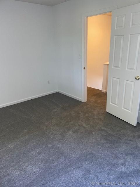 273 Derby Ave Unit 810, Derby, CT 06418 - unfurnished room featuring dark colored carpet and baseboards